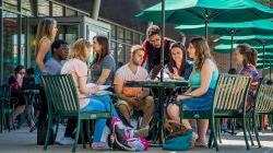 Photo of students meeting on the terrace of Cafe Diem